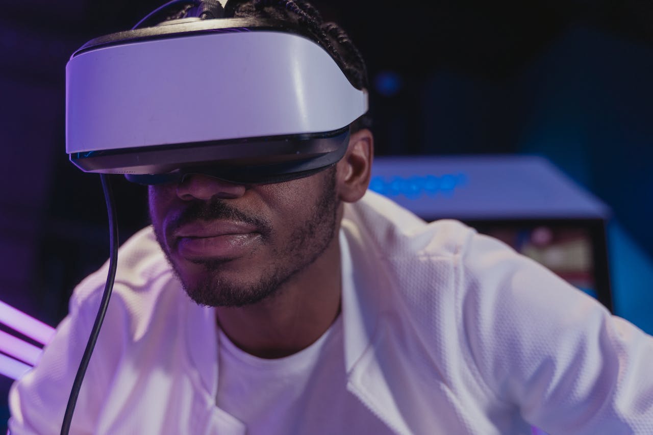 A man wearing VR glasses fully immersed in a virtual reality experience indoors.